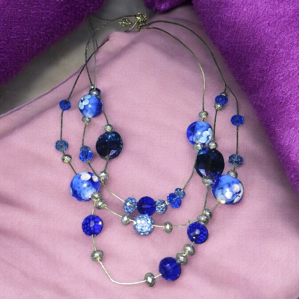 Multi-Strand Blue Necklace with Layered Beads and Sparkling Accents